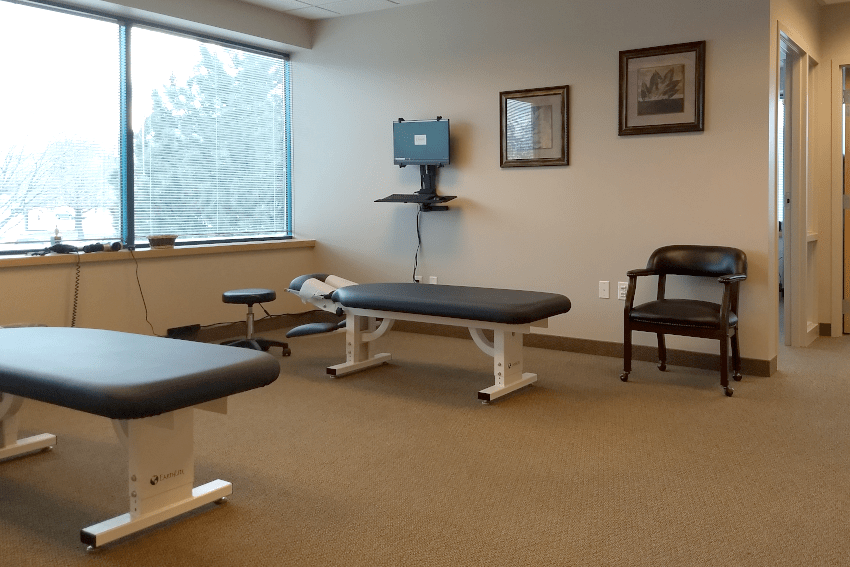 Frequently Asked Questions Page: Dual Adjusting Tables at Seasons Chiropractic - A view of the two adjusting tables, ready to provide personalized care and chiropractic adjustments for our patients.