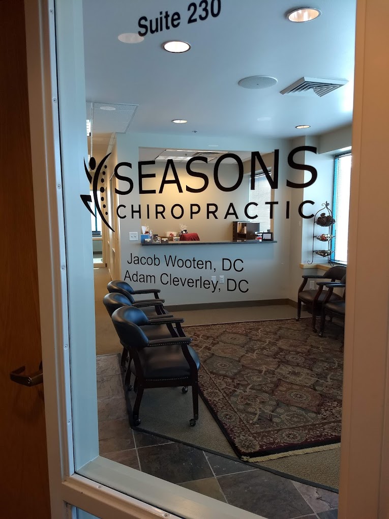 Image: Seasons Chiropractic Clinic Entrance - A view of our welcoming front door and window showcasing the company name, doctor names, and suite number.